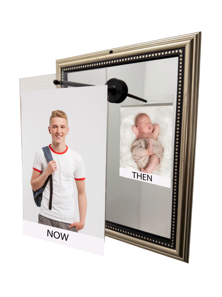 A mirror displaying two photos side by side: one of a young man today labeled 'NOW' and a baby photo labeled 'THEN'.